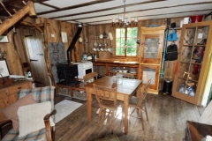 The sitting room and kitchen at Poacher's Cabin
