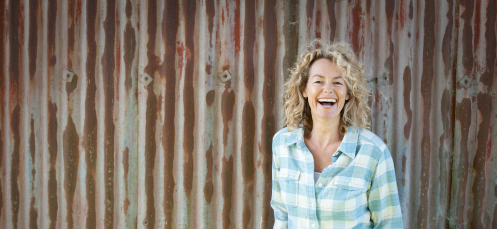 Kate Humble by the red barn at Humble by Nature